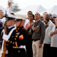 President Barack Obama and first lady Michelle Obama join Michigan State coach Tom Izzo (right) and the men’s basketball team as they watch a flyover from the flight deck of the USS Carl Vinson before the Carrier Classic NCAA basketball game between Michigan State and North Carolina on Nov. 11, 2011, in Coronado, Calif.